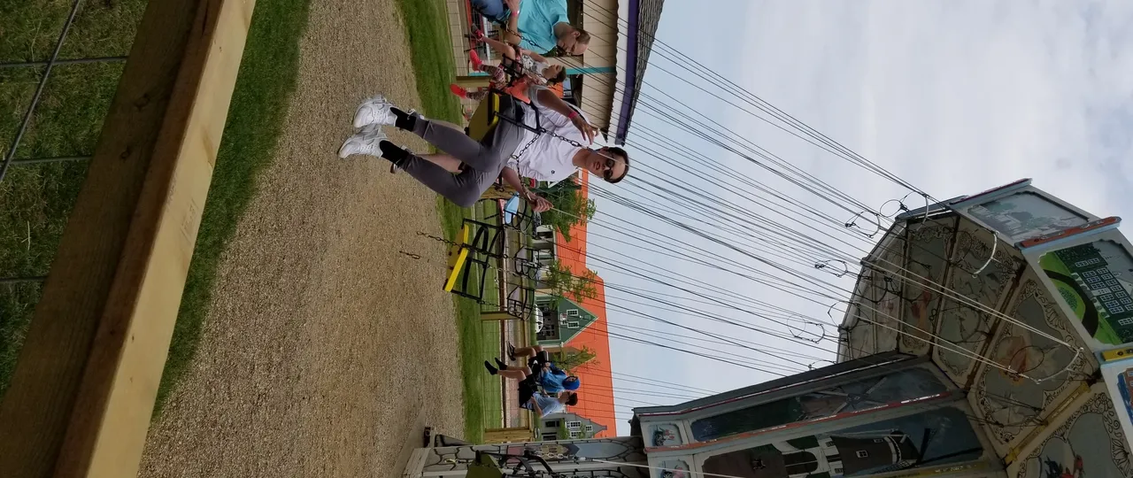 People riding the Dutch Chair Swing